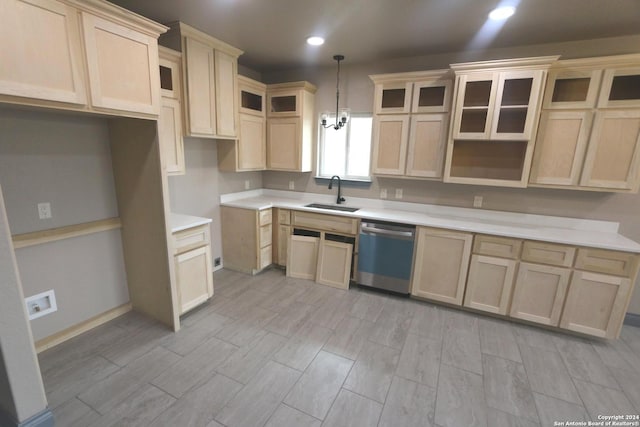 kitchen with pendant lighting, dishwasher, light brown cabinets, and sink