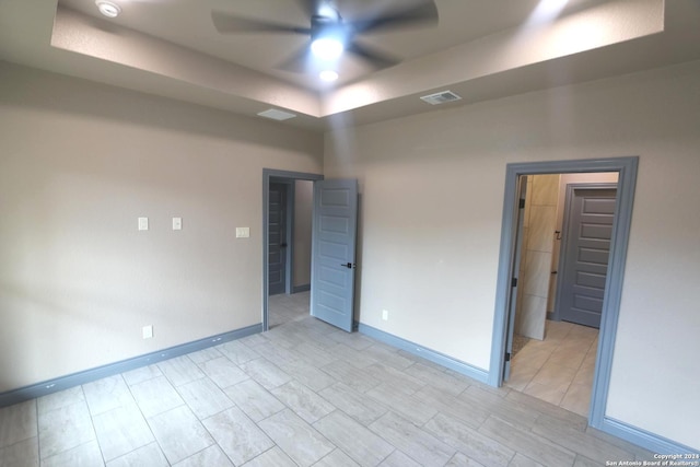 empty room with light hardwood / wood-style flooring and ceiling fan