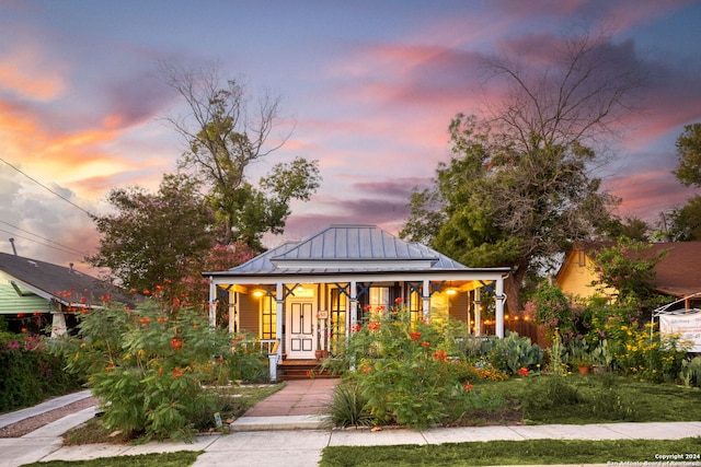 view of front of home featuring covered porch