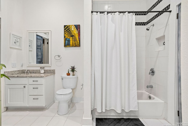 full bathroom featuring shower / bath combination with curtain, vanity, tile patterned flooring, and toilet