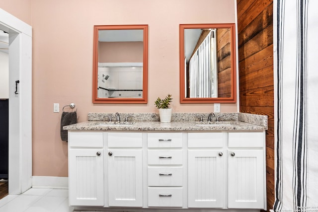 bathroom with tile patterned floors and vanity