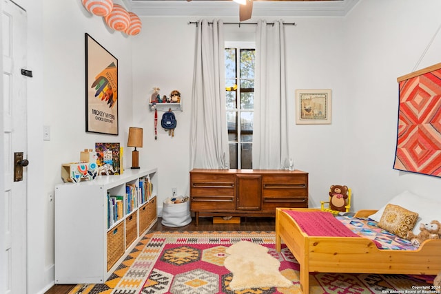 interior space with ornamental molding and wood-type flooring