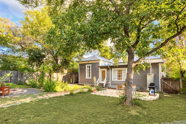 exterior space with a lawn and a patio