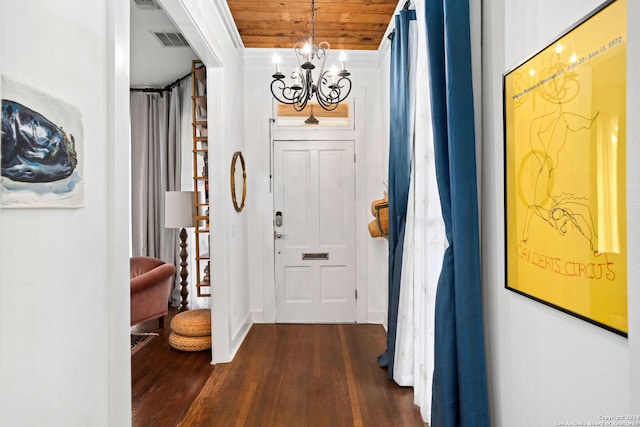 entrance foyer featuring wooden ceiling, ornamental molding, dark hardwood / wood-style flooring, and a chandelier