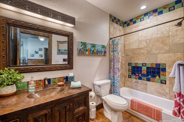 full bathroom with shower / bath combination with curtain, tile patterned flooring, a textured ceiling, vanity, and toilet