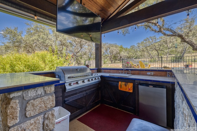 view of patio featuring grilling area, area for grilling, and sink