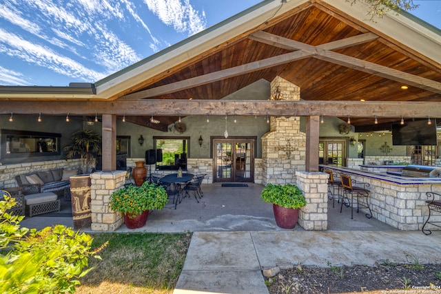 view of patio featuring an outdoor bar and exterior kitchen