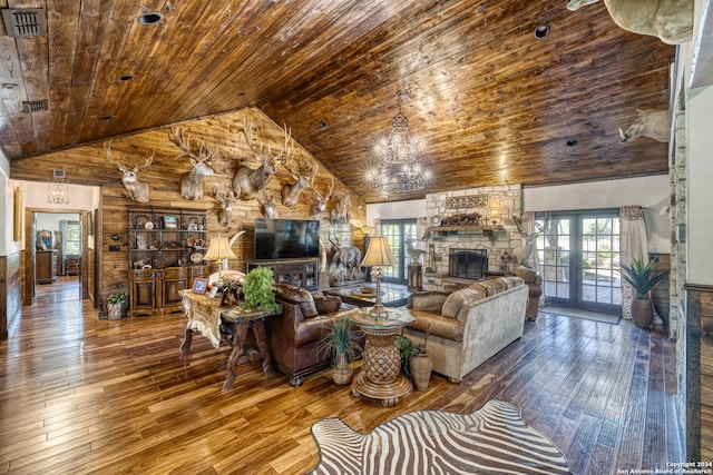 living room featuring hardwood / wood-style flooring, a fireplace, wood ceiling, and high vaulted ceiling