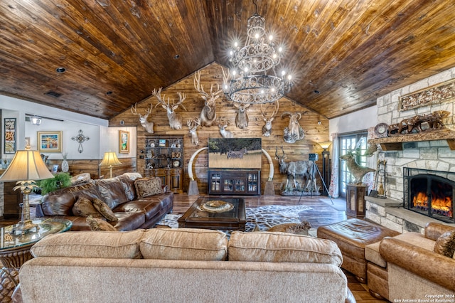 living room featuring a stone fireplace, wooden walls, wooden ceiling, a notable chandelier, and hardwood / wood-style floors