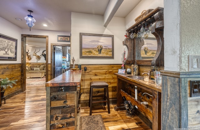 interior space with wood-type flooring and wooden counters