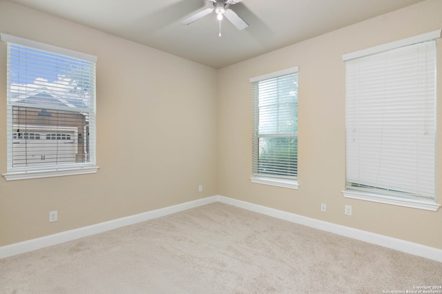 carpeted empty room with ceiling fan