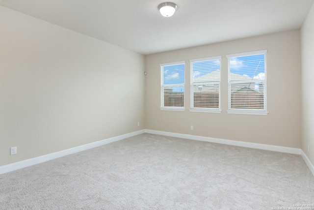 unfurnished room featuring carpet