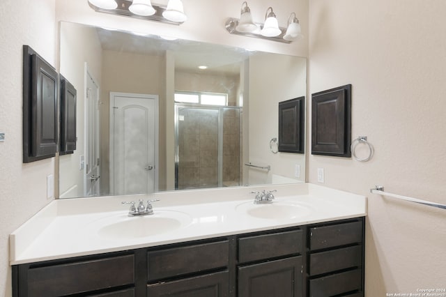 bathroom with an enclosed shower and vanity