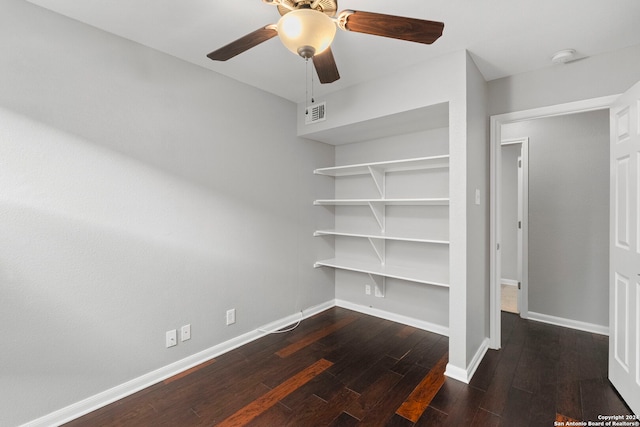 unfurnished bedroom featuring dark hardwood / wood-style floors and ceiling fan