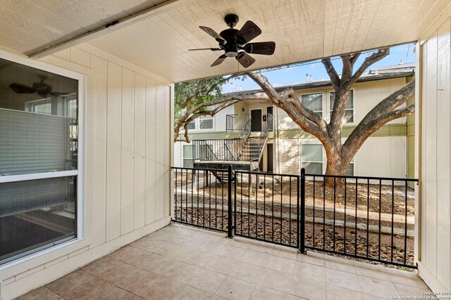 view of patio / terrace featuring a ceiling fan and a balcony