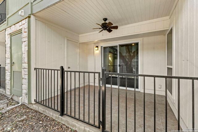 view of patio / terrace featuring ceiling fan, a gate, and fence