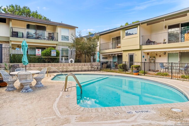community pool featuring fence