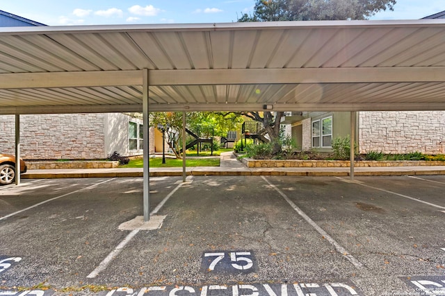 view of parking / parking lot featuring a carport