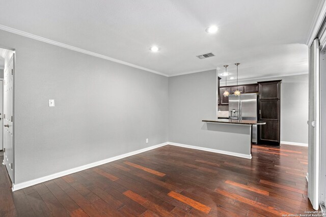 unfurnished living room featuring baseboards, recessed lighting, ornamental molding, and dark wood-type flooring