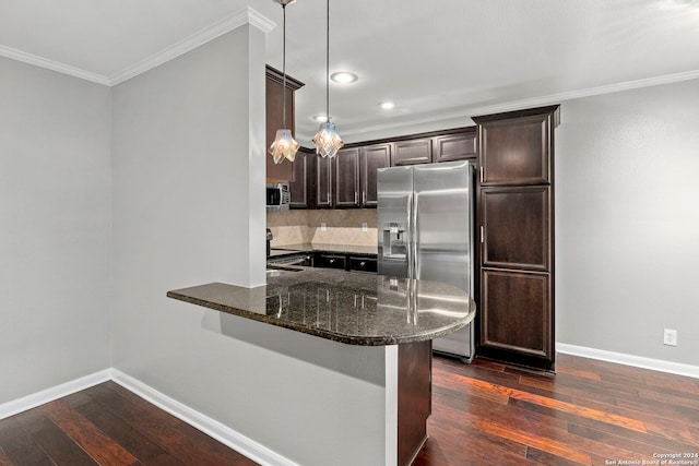 kitchen with pendant lighting, kitchen peninsula, appliances with stainless steel finishes, and dark hardwood / wood-style flooring