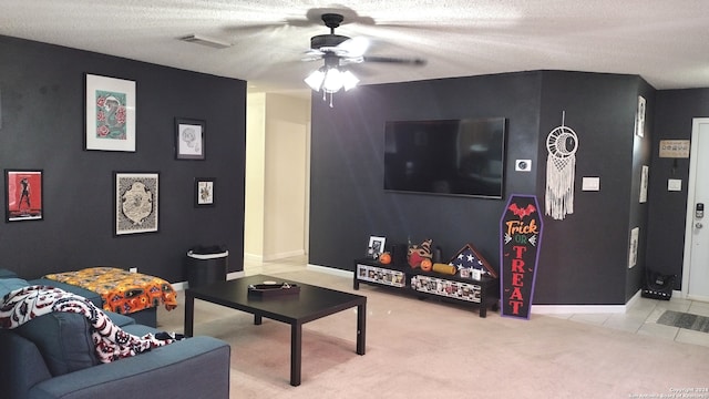 carpeted living room with ceiling fan and a textured ceiling