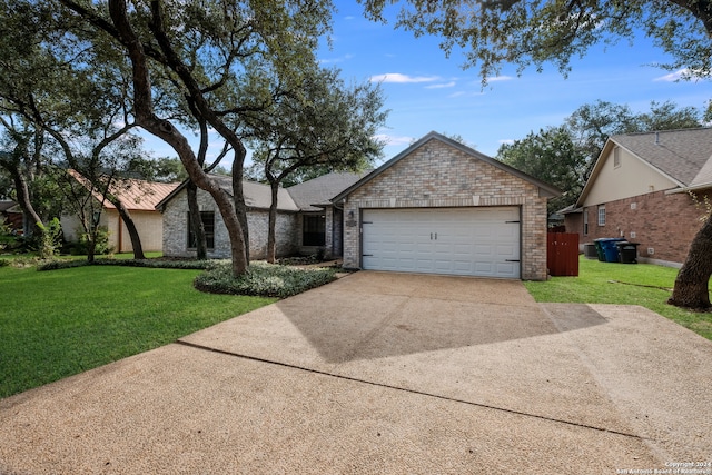 view of front of home featuring a garage and a front yard