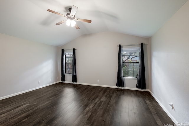 unfurnished room featuring ceiling fan, dark hardwood / wood-style flooring, and a wealth of natural light