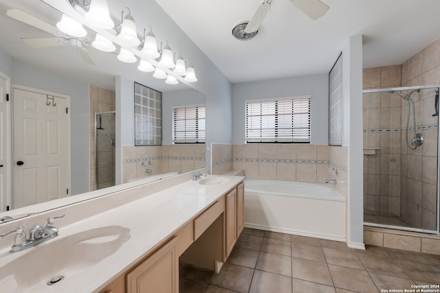 bathroom with ceiling fan, shower with separate bathtub, vanity, and tile patterned floors