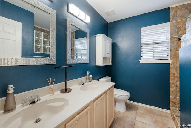 bathroom featuring tile patterned flooring, vanity, and toilet