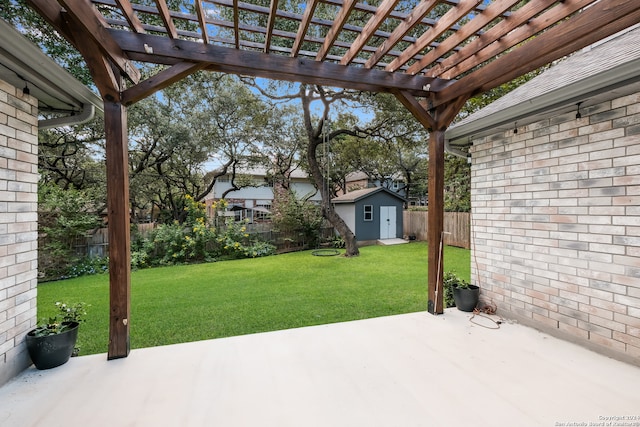 view of patio with a storage unit and a pergola