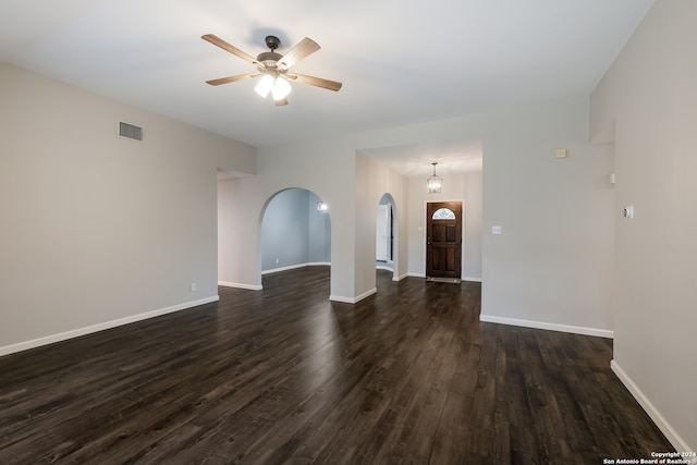 unfurnished room featuring ceiling fan and dark hardwood / wood-style flooring