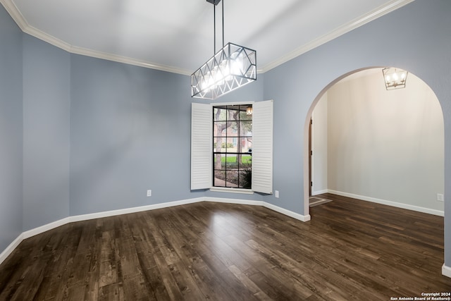 unfurnished room with ornamental molding, dark hardwood / wood-style flooring, and a notable chandelier