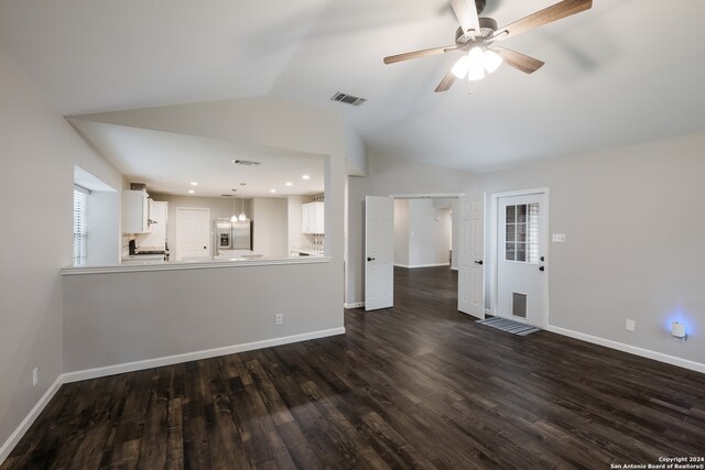 unfurnished living room with lofted ceiling, ceiling fan, and dark wood-type flooring