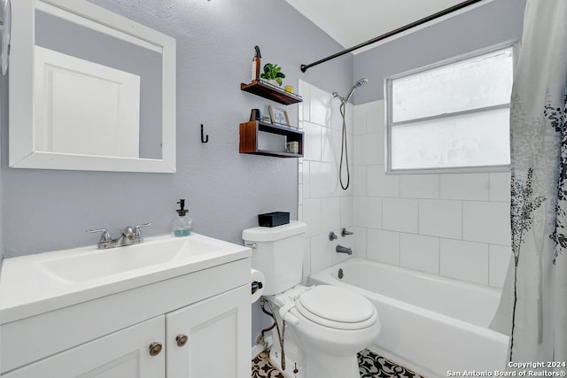 full bathroom featuring shower / tub combo with curtain, vanity, and toilet