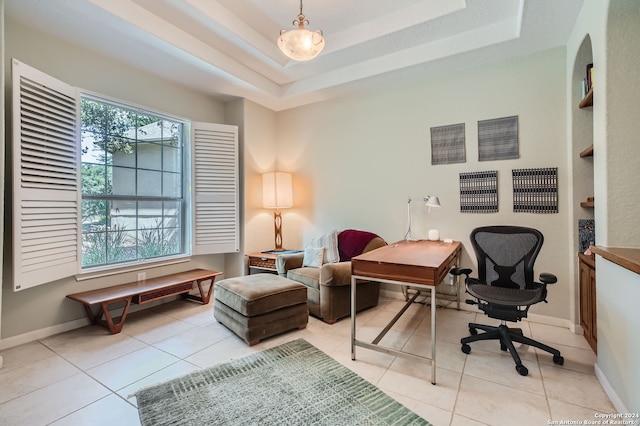 tiled home office with a tray ceiling