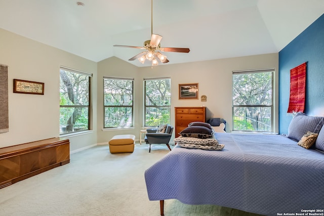 bedroom with ceiling fan, carpet floors, and lofted ceiling