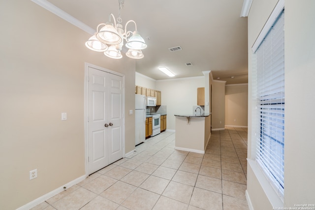 kitchen with hanging light fixtures, white appliances, light tile patterned floors, crown molding, and an inviting chandelier