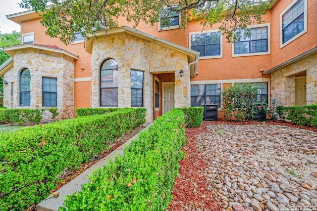 view of front of property featuring cooling unit