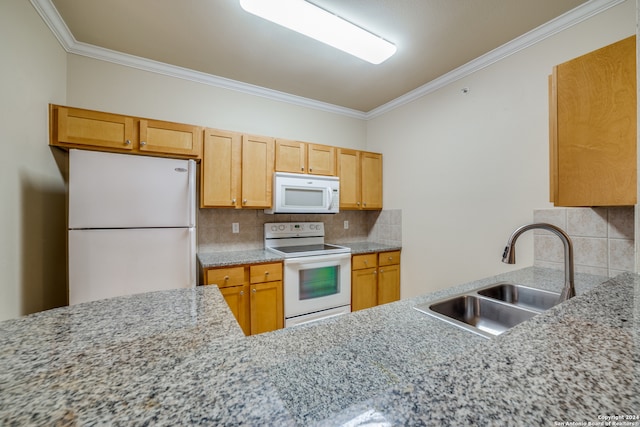 kitchen with ornamental molding, white appliances, tasteful backsplash, and sink