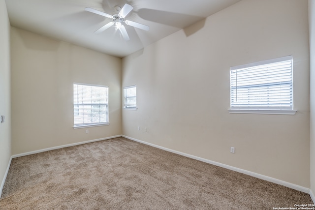 carpeted empty room with ceiling fan