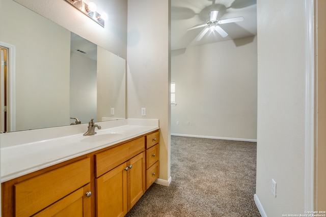 bathroom featuring ceiling fan and vanity