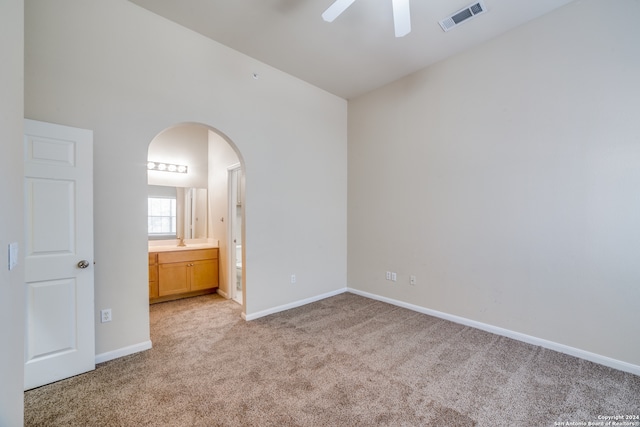 carpeted empty room with ceiling fan