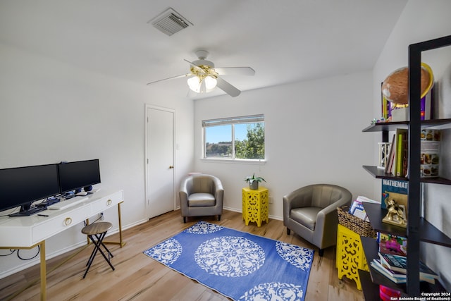 interior space featuring wood-type flooring and ceiling fan