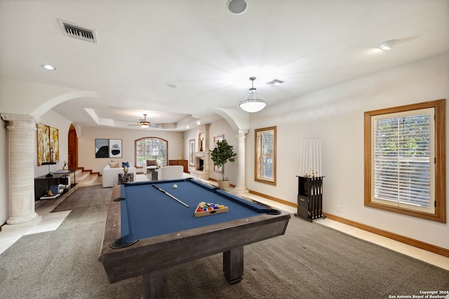 rec room with carpet floors, a raised ceiling, ceiling fan, pool table, and decorative columns