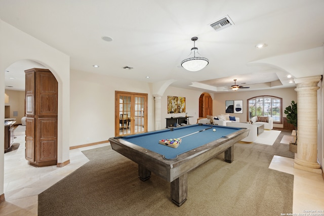 rec room with ceiling fan, a tray ceiling, decorative columns, and pool table