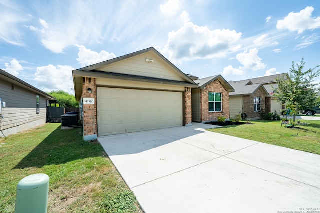 view of front of house featuring a front lawn, central AC unit, and a garage