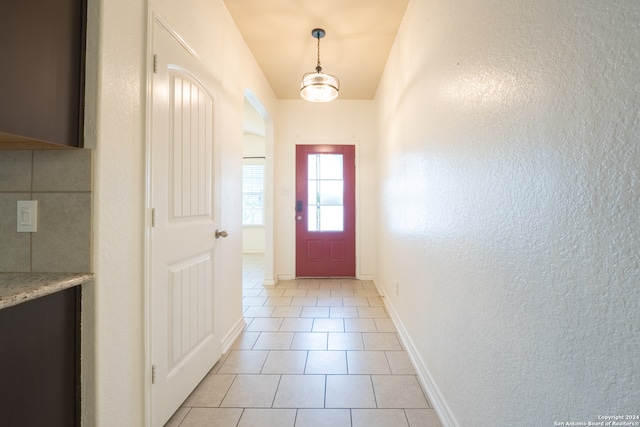 doorway featuring light tile patterned floors