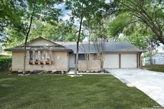 ranch-style house with a front lawn and a garage