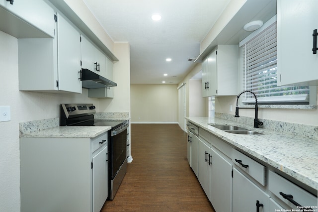 kitchen with light stone counters, sink, white cabinets, stainless steel electric stove, and dark hardwood / wood-style flooring