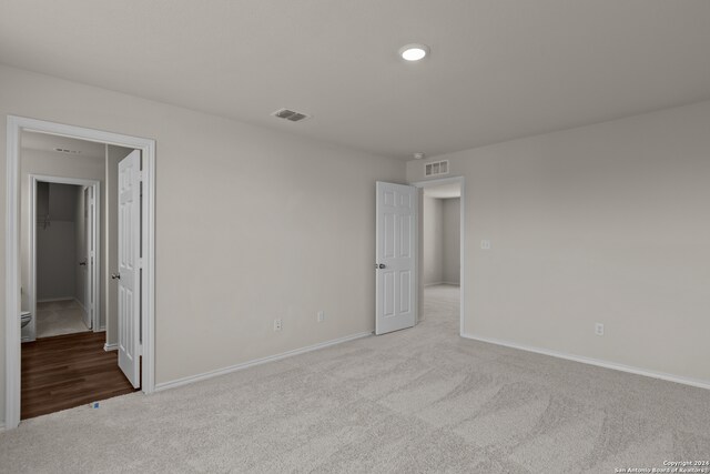 empty room with light colored carpet